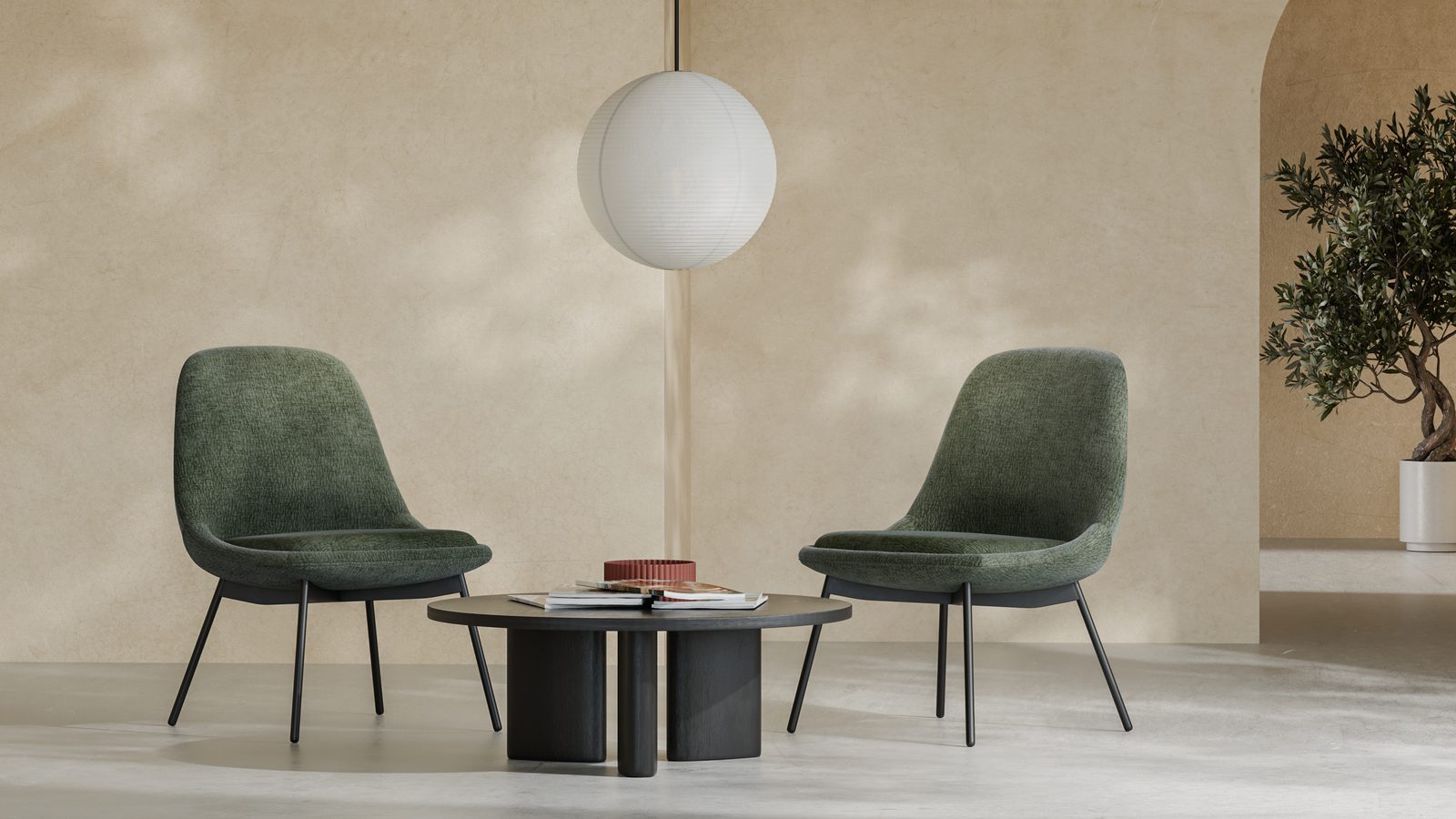 Two Mary guest chairs in Sage beside a coffee table